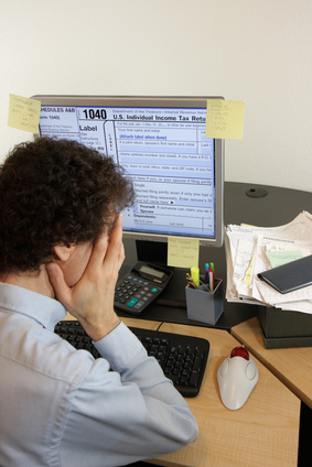 Man agonizing over taxes